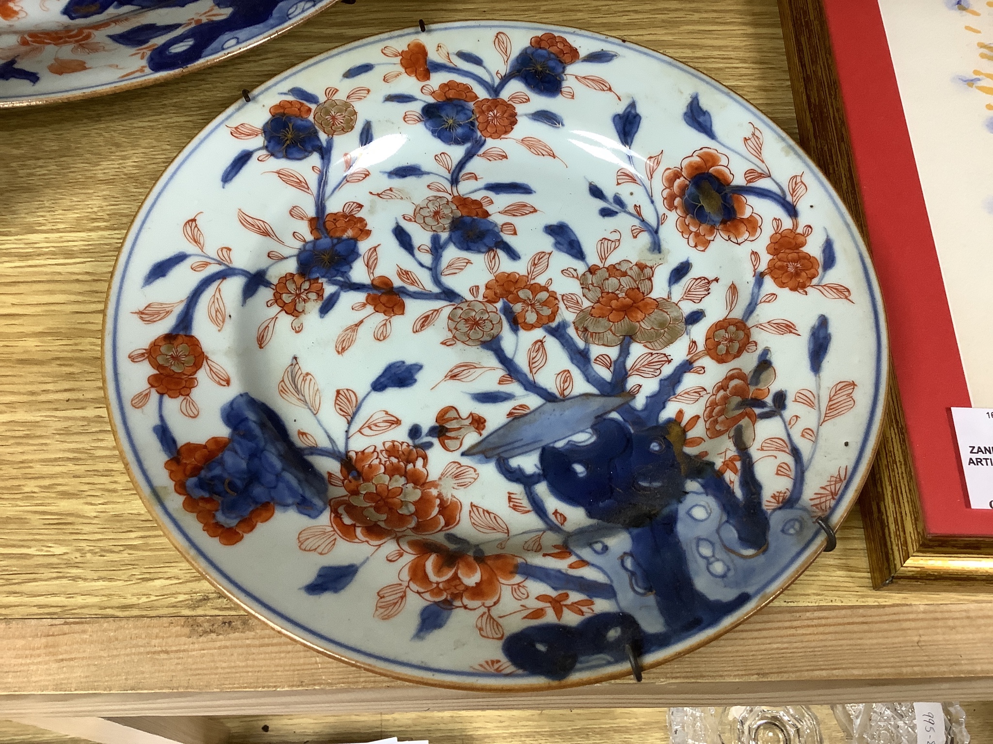 Three Japanese Imari plates together with a larger dish, 18th century, diameter 32cm